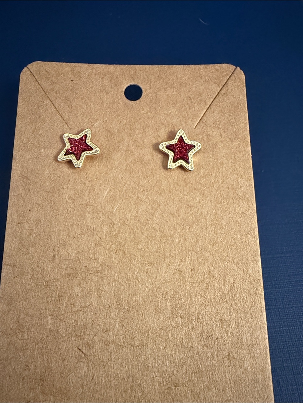 Kendra Scott Gold Star Stud Earrings with Red Glitter Centers